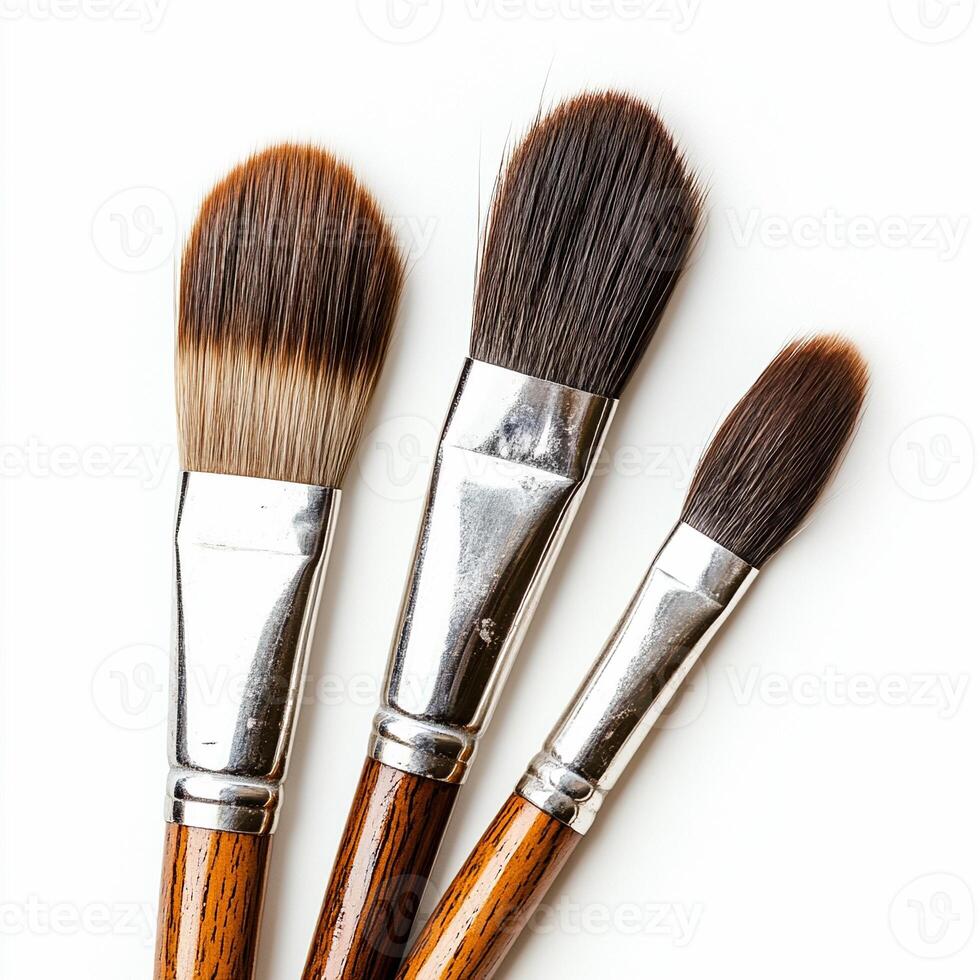 Three paintbrushes with natural bristles for creative art projects photo