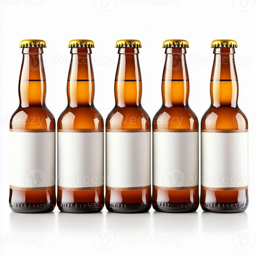 Five brown beer bottles standing in a row with blank labels photo