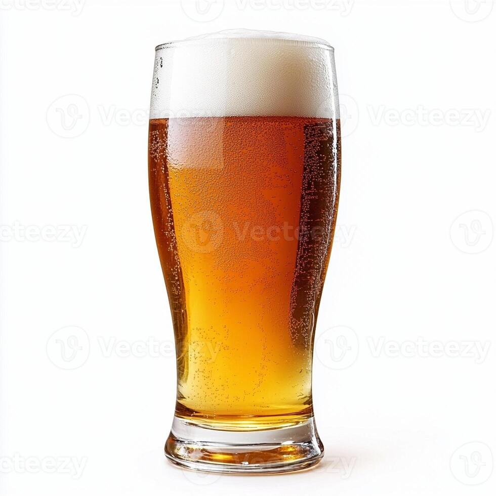 Glass of cold lager beer with condensation and foam head photo