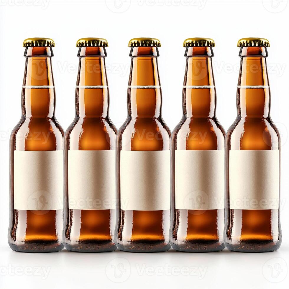 Row of five brown glass beer bottles standing on white background with blank labels photo