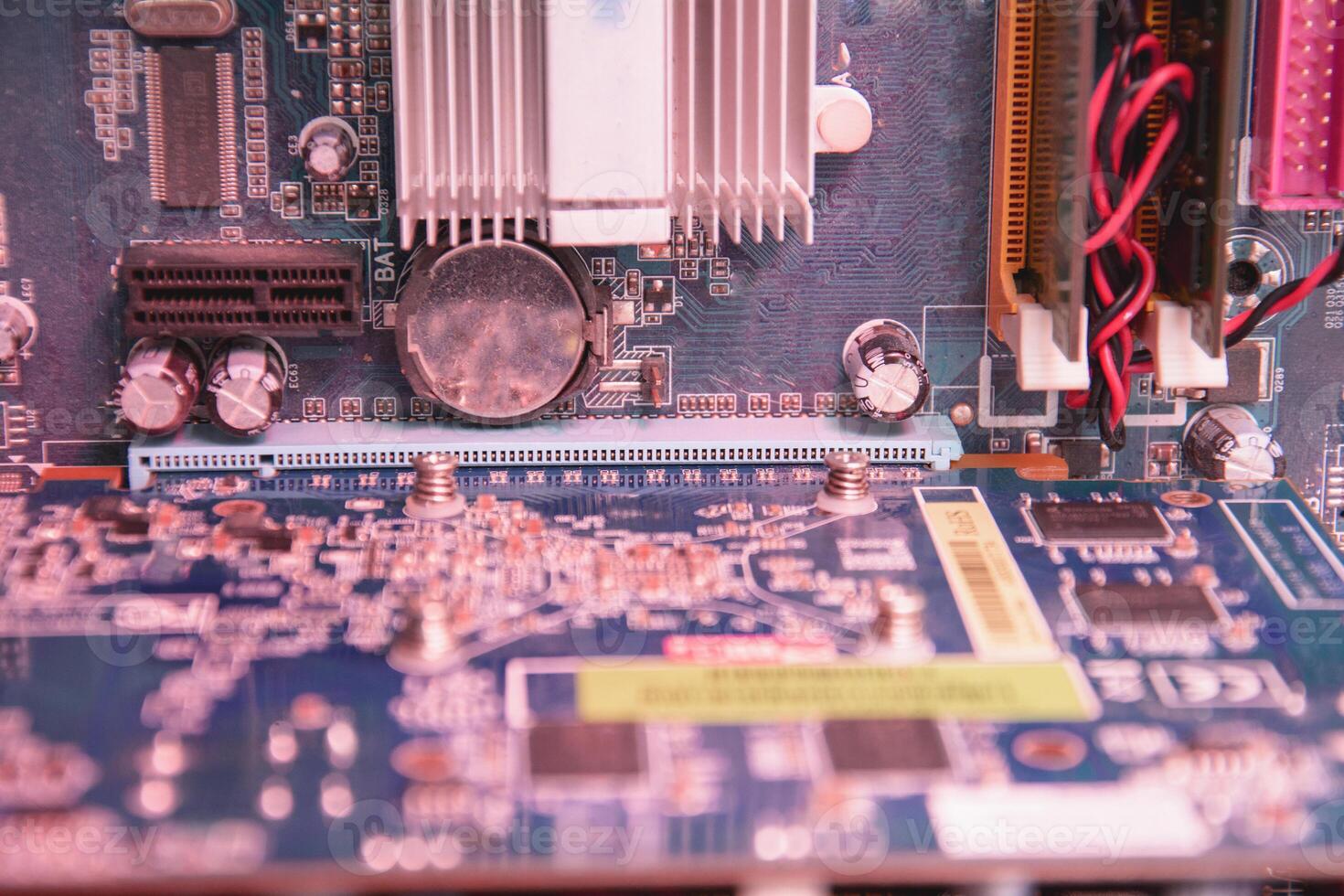A close up of a computer motherboard photo