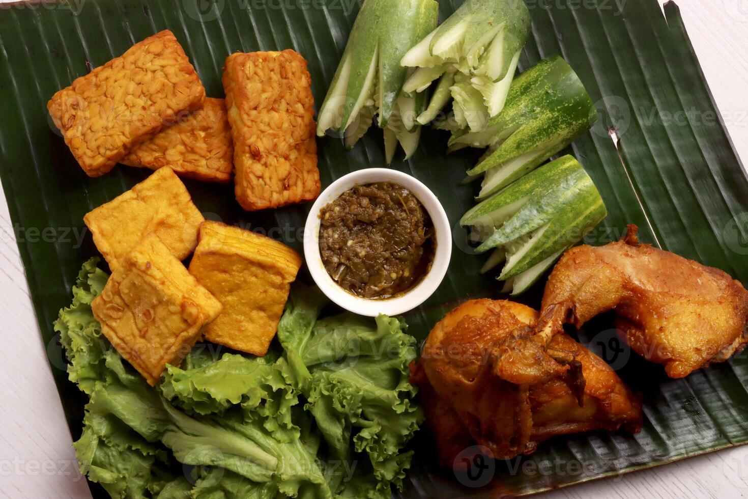 indonesian traditional food culinary business fried chicken ayam goreng cucumber chili sauce asian photo