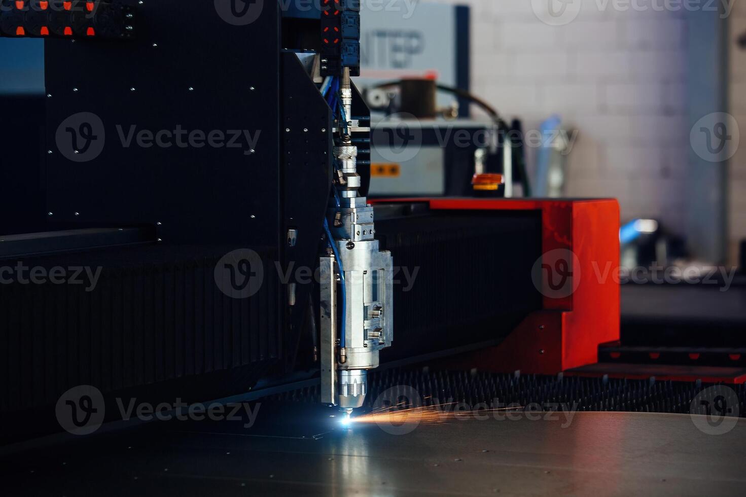 Laser cutting machine with CNC is cutting the steel sheet photo