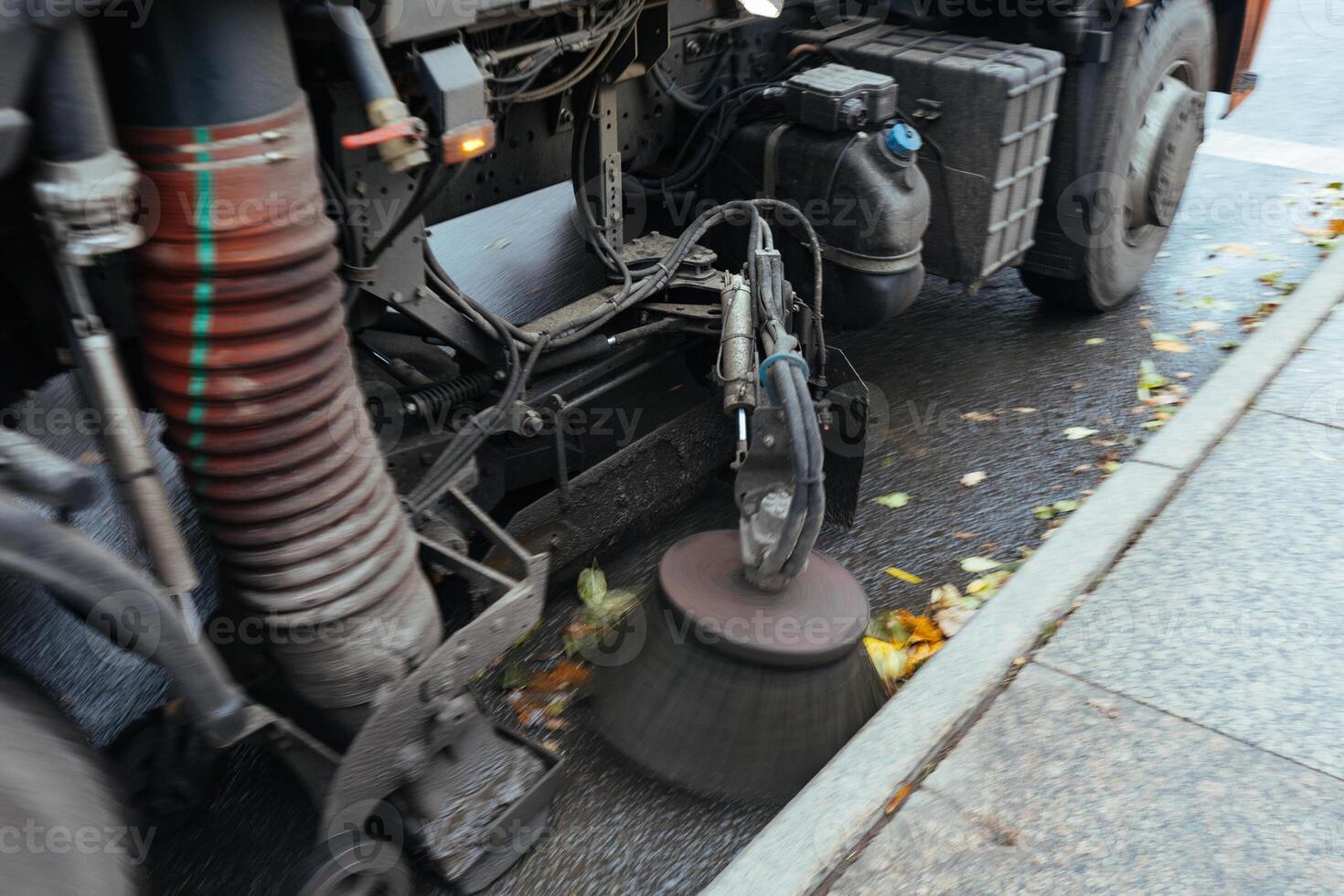 Working rotating brush of city cleaning machine photo
