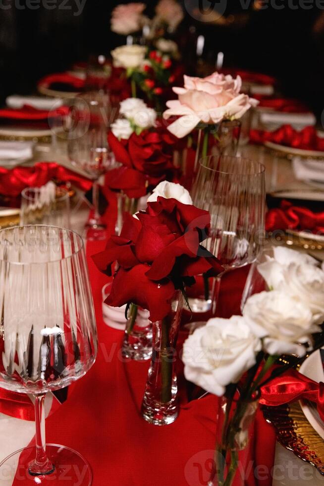 red rose in a vase on the table wedding decoration photo