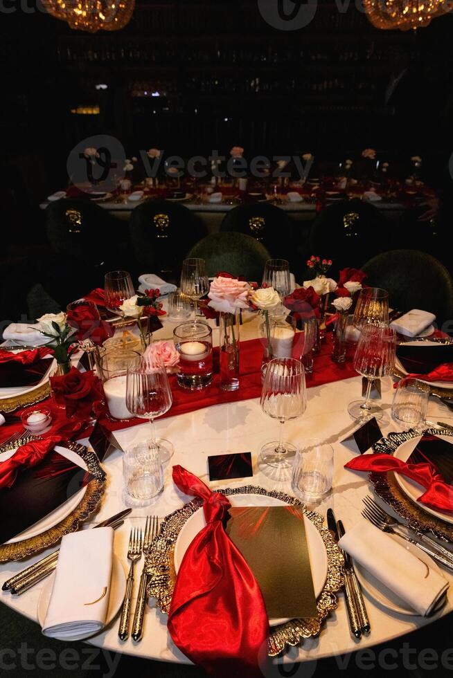 A red napkin on a luxurious wedding table for guests creates an elegant ambiance photo