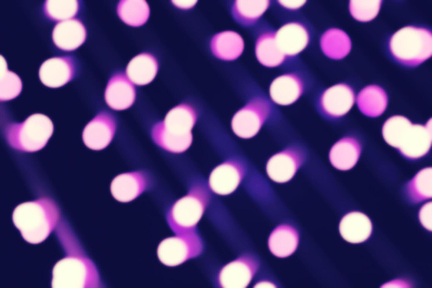 Abstract soft purple or violet light bokeh on black background. photo