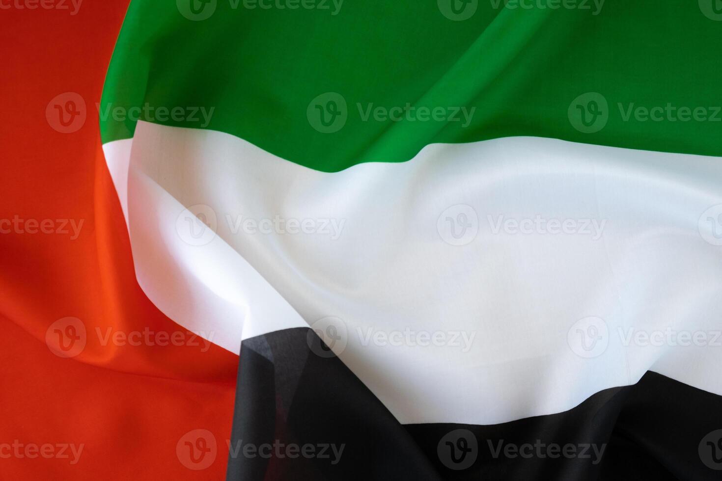 National symbol of UAE. United Arab Emirates flag background. Copy space for your text. Concept of National day Independence photo