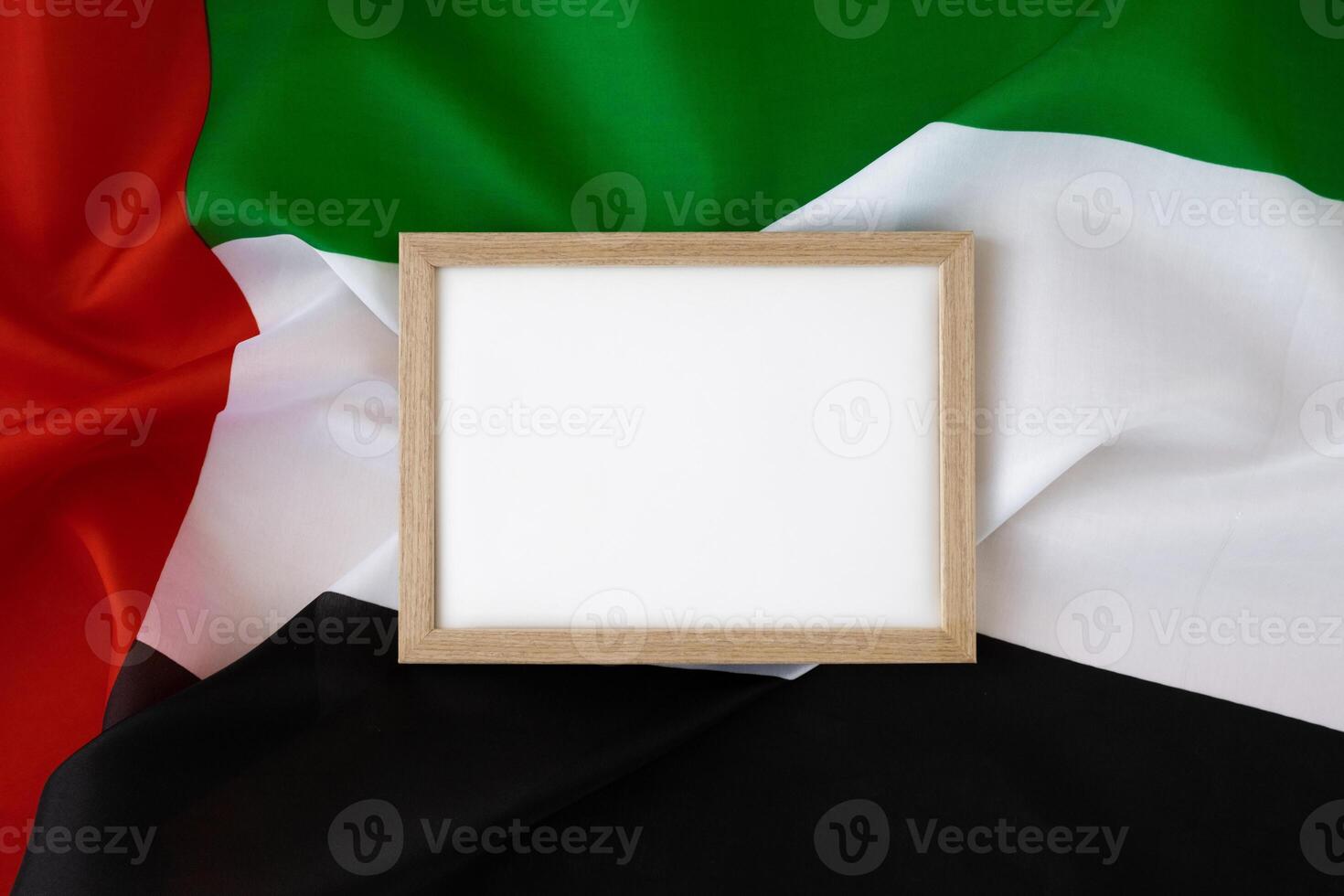 Empty white paper frame Small flag of UAE on beige background with colorful envelopes. Copy space. Mock up advertisement template. Tourism travel voucher with United Arab Emirates national symbol. Visit Dubai concept photo
