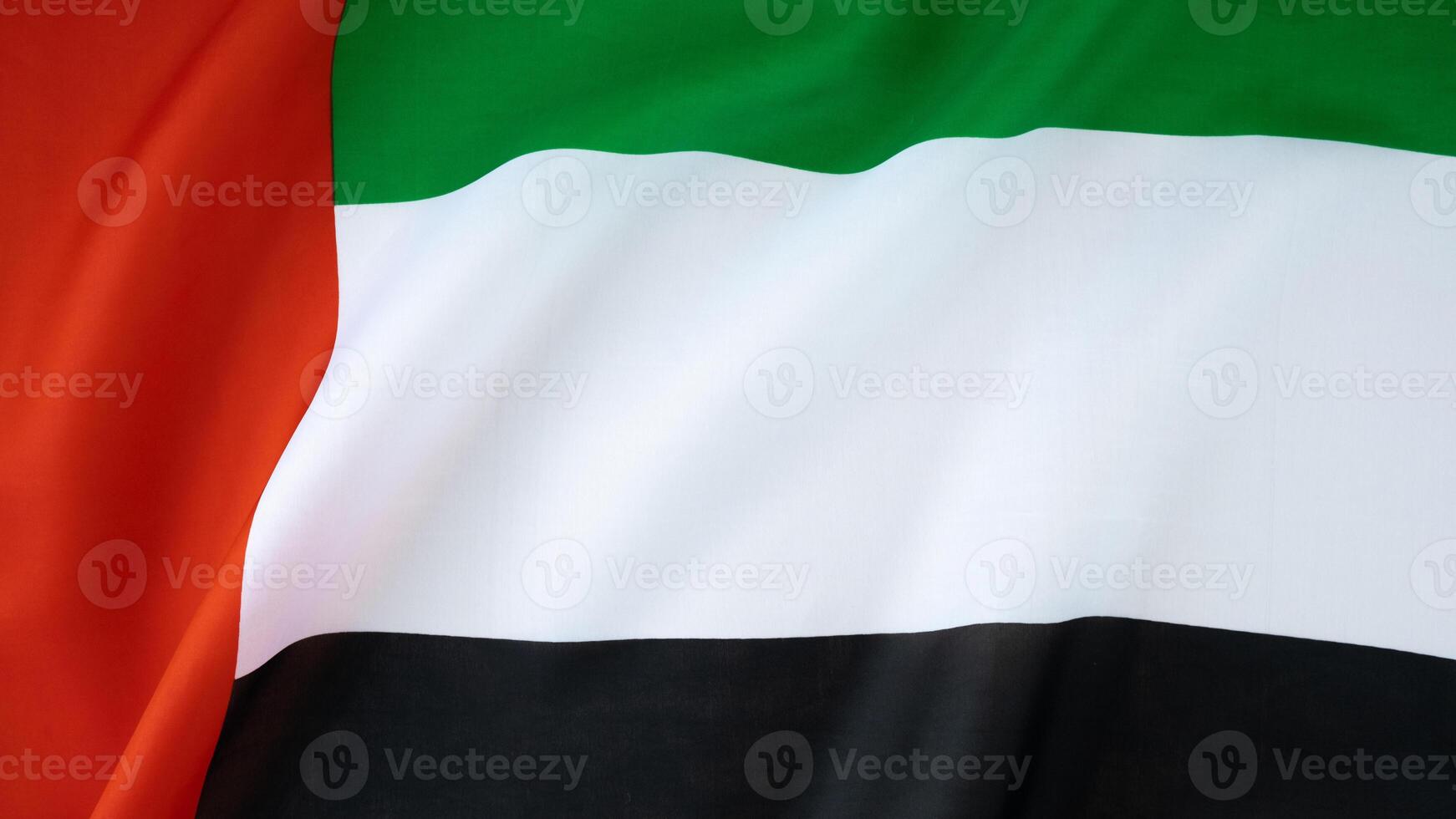 National symbol of UAE. United Arab Emirates flag background. Copy space for your text. Concept of National day Independence photo