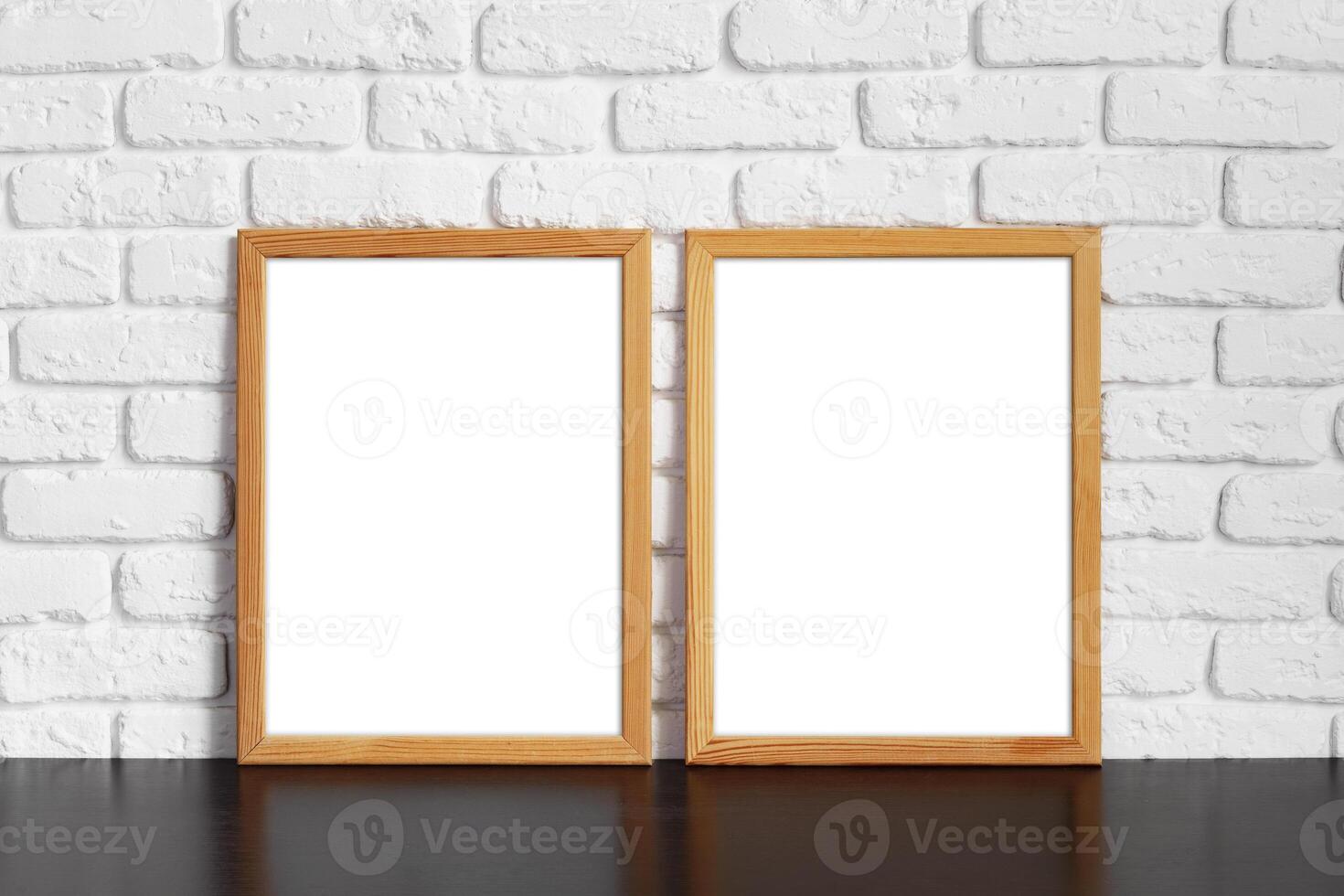 Blank picture frame against brick wall with copy space photo