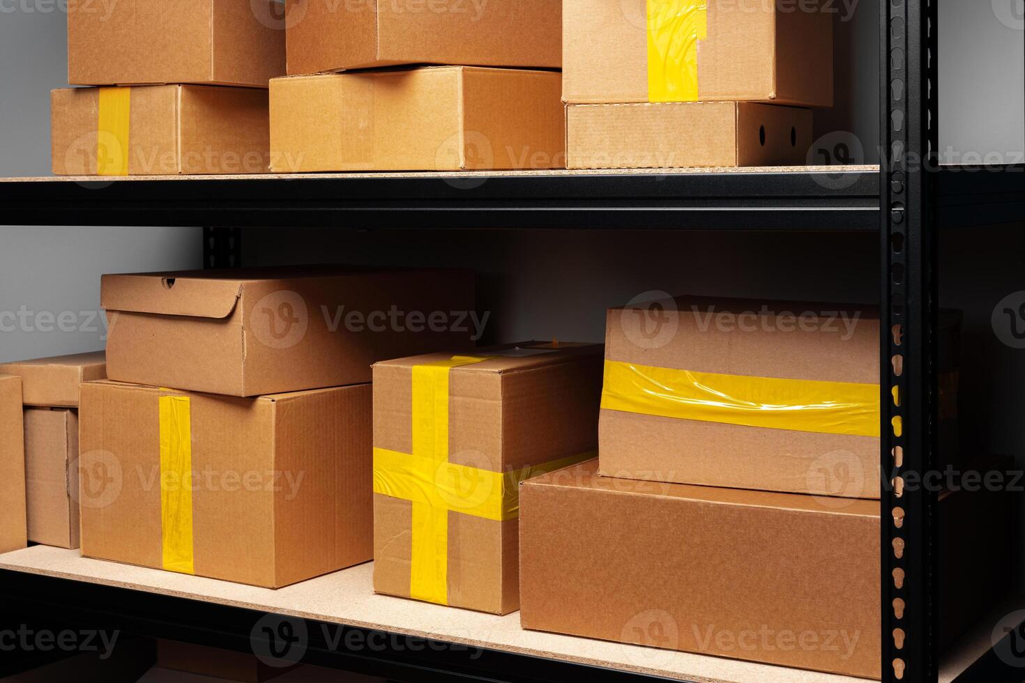 Rows of shelves with cardboard boxes in modern warehouse photo