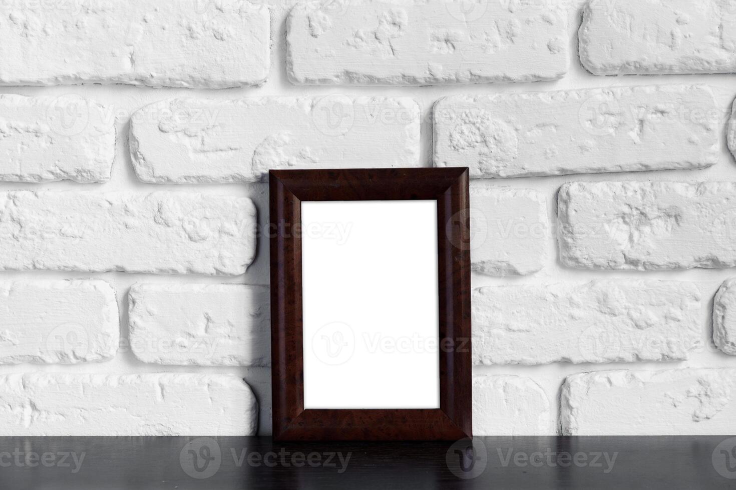 Photo frame with copy space against white brick wall
