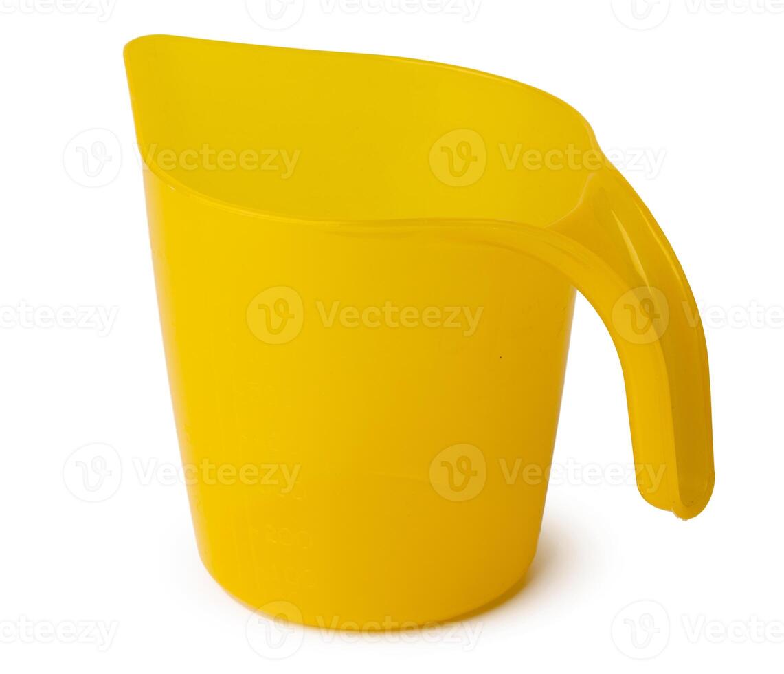 Yellow plastic household dipper isolated on white photo