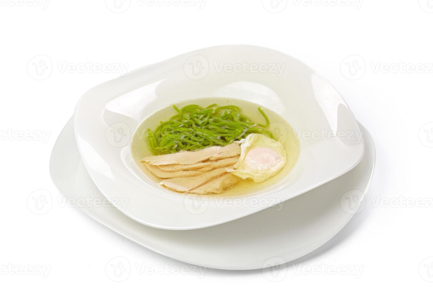 Chicken soup with noodles isolated on white photo