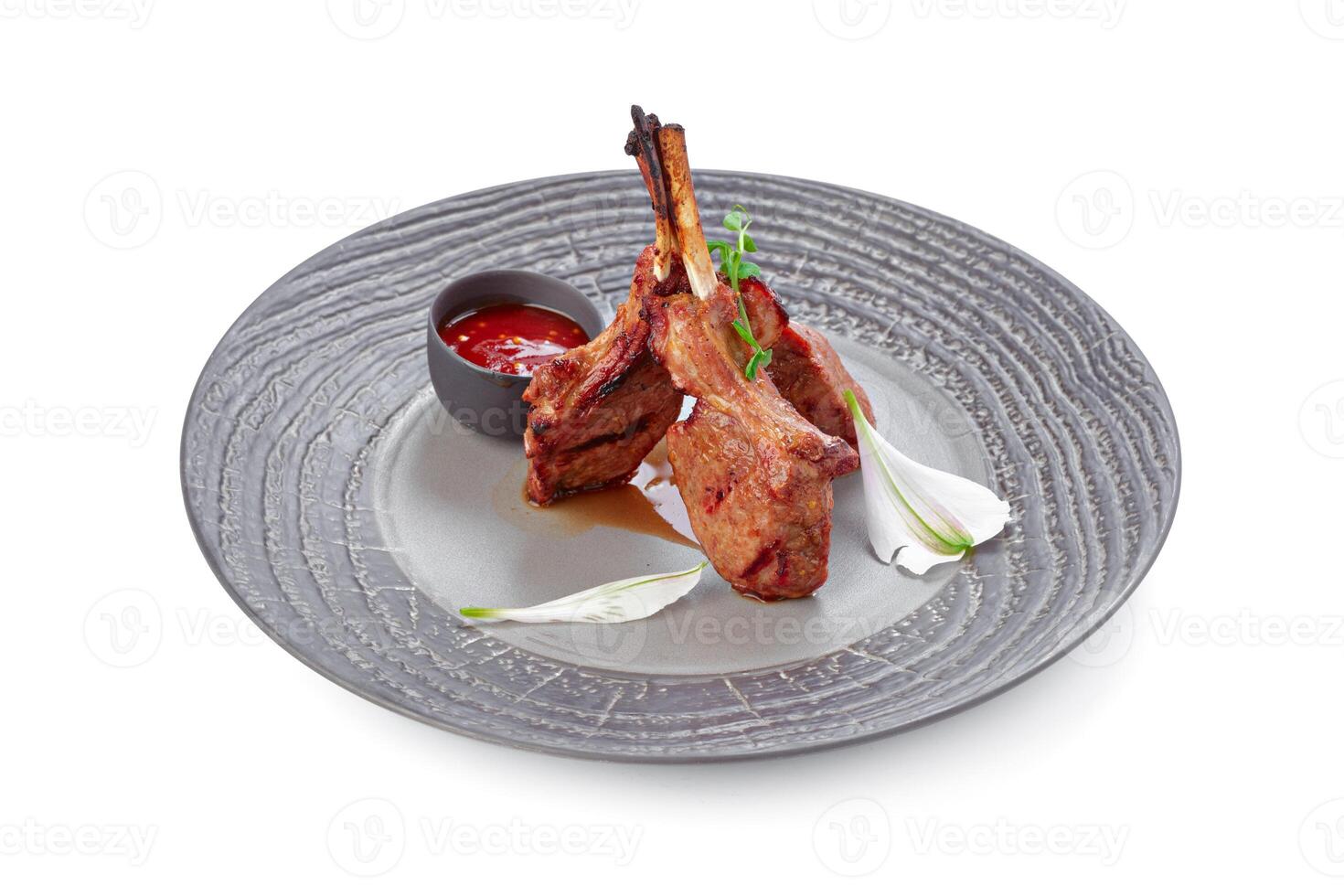 Grilled beef steak on grey plate isolated on white photo