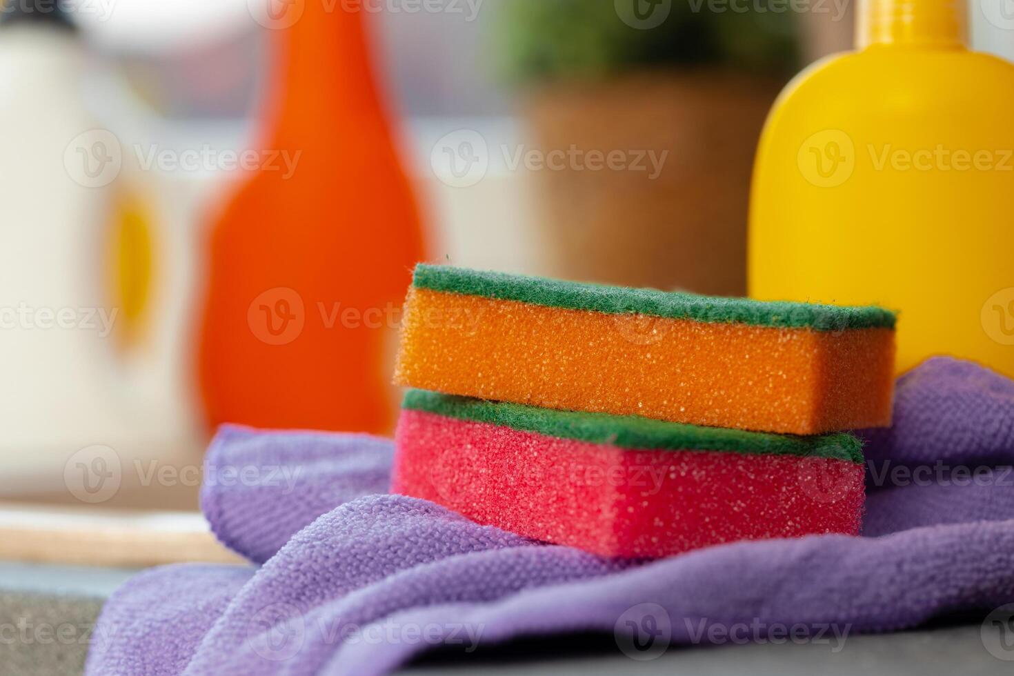 Cleaning sponge and rag on kitchen counter photo