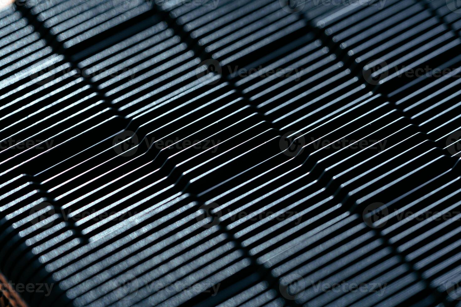 Cooler fan grille of computer power supply close up photo