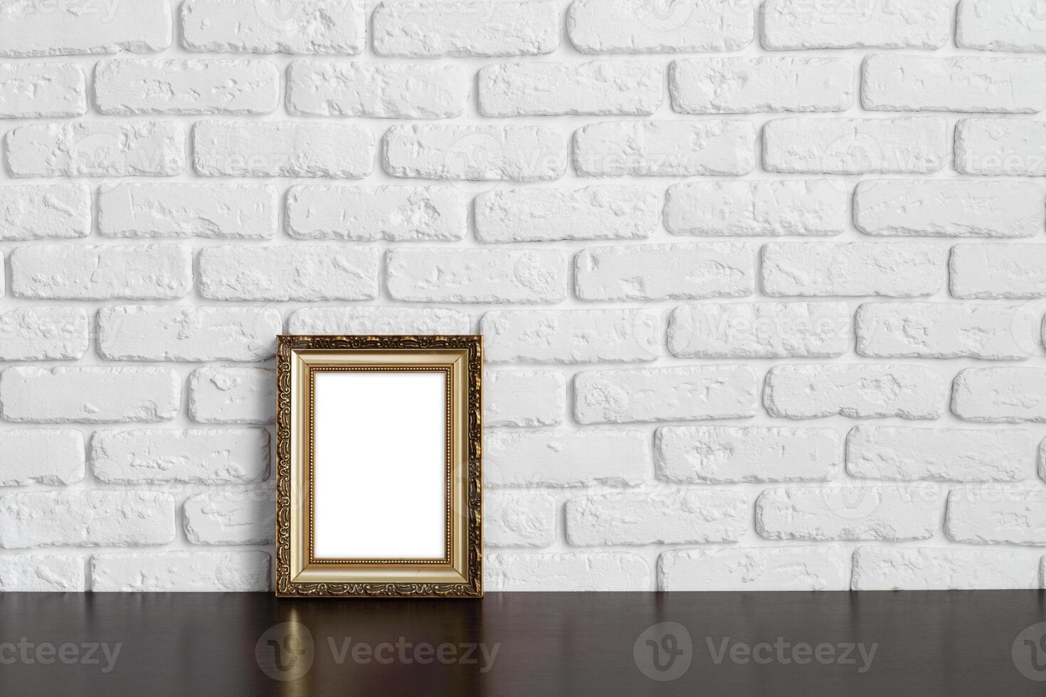 Blank picture frame against brick wall with copy space photo