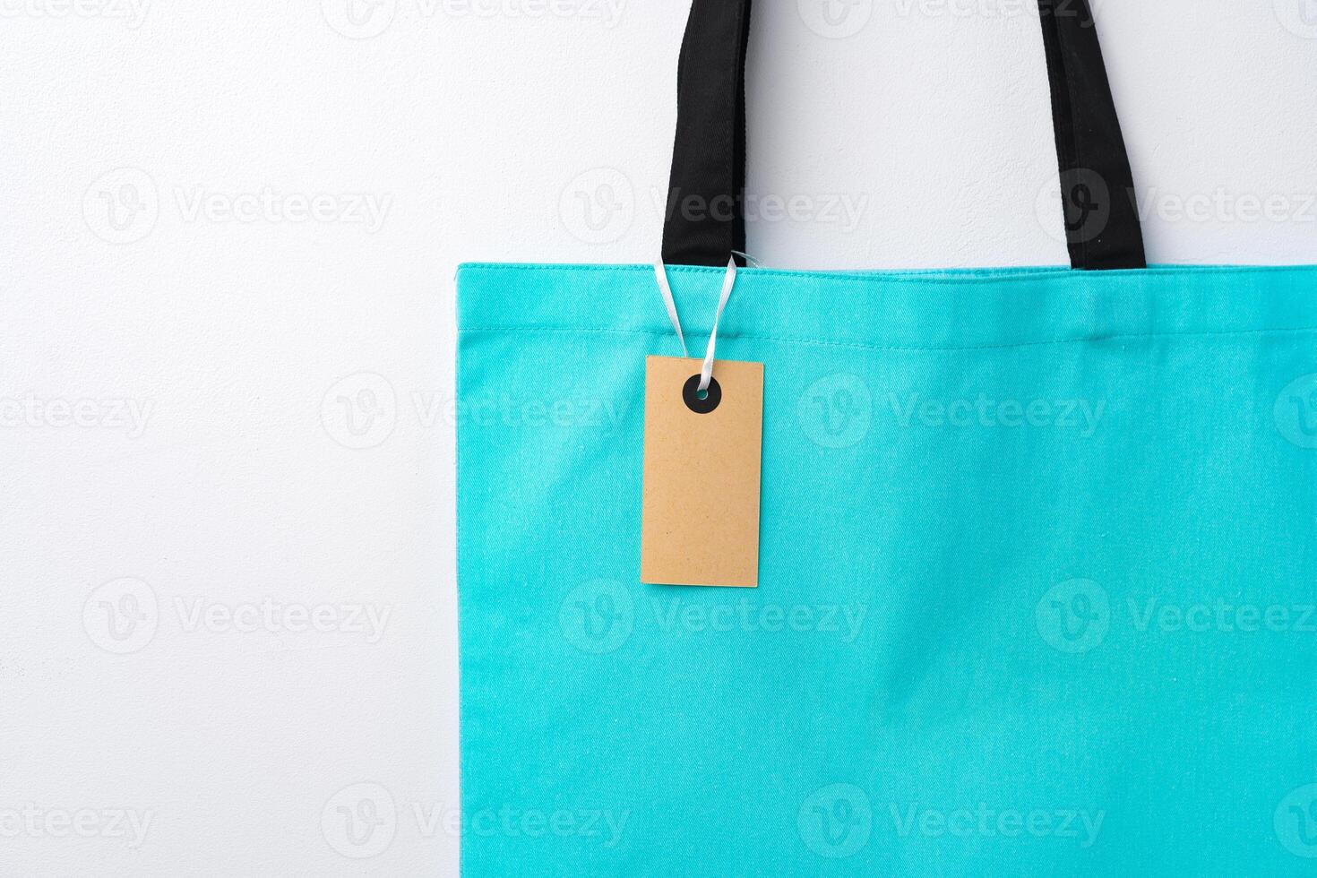 Eco bag for shopping with blank tag on white background photo