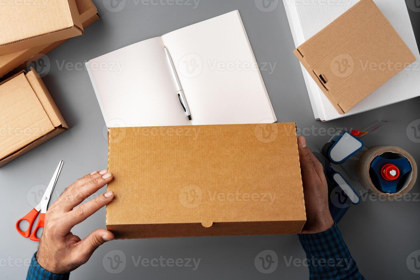 Above table top view of warehouse preparing post courier delivery package photo