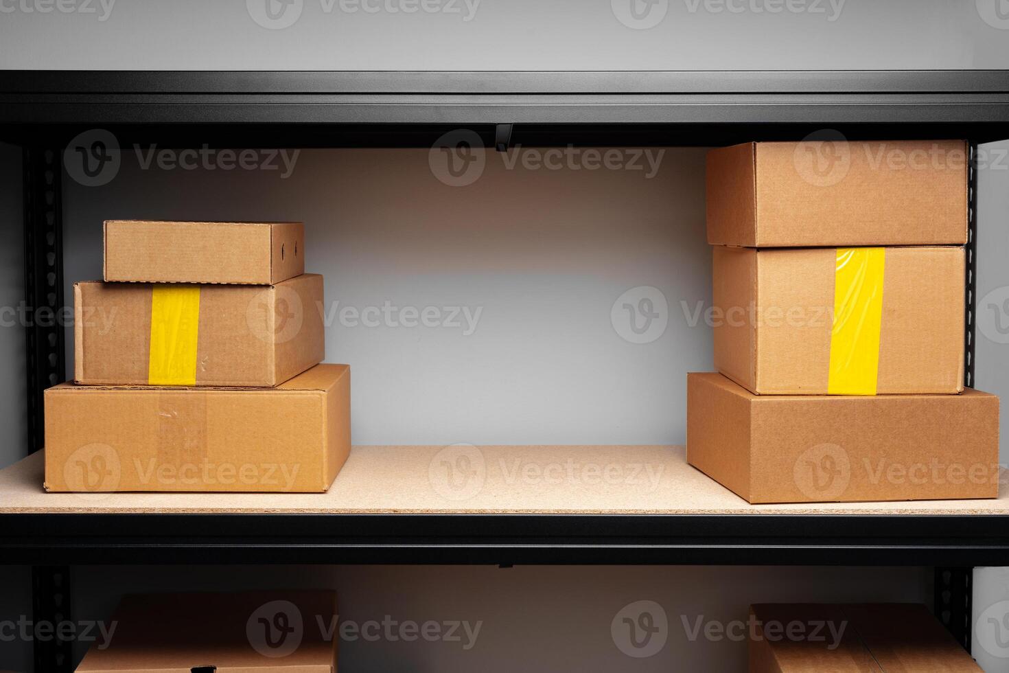 Rows of shelves with cardboard boxes in modern warehouse photo