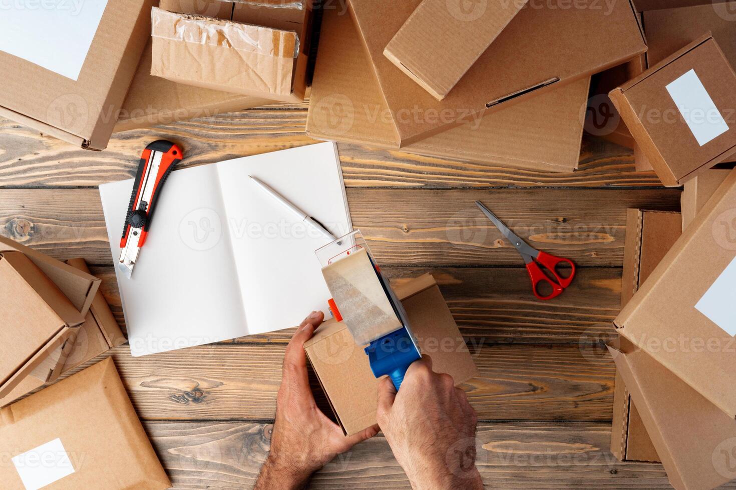 Packing products for delivery on wooden table, top view photo