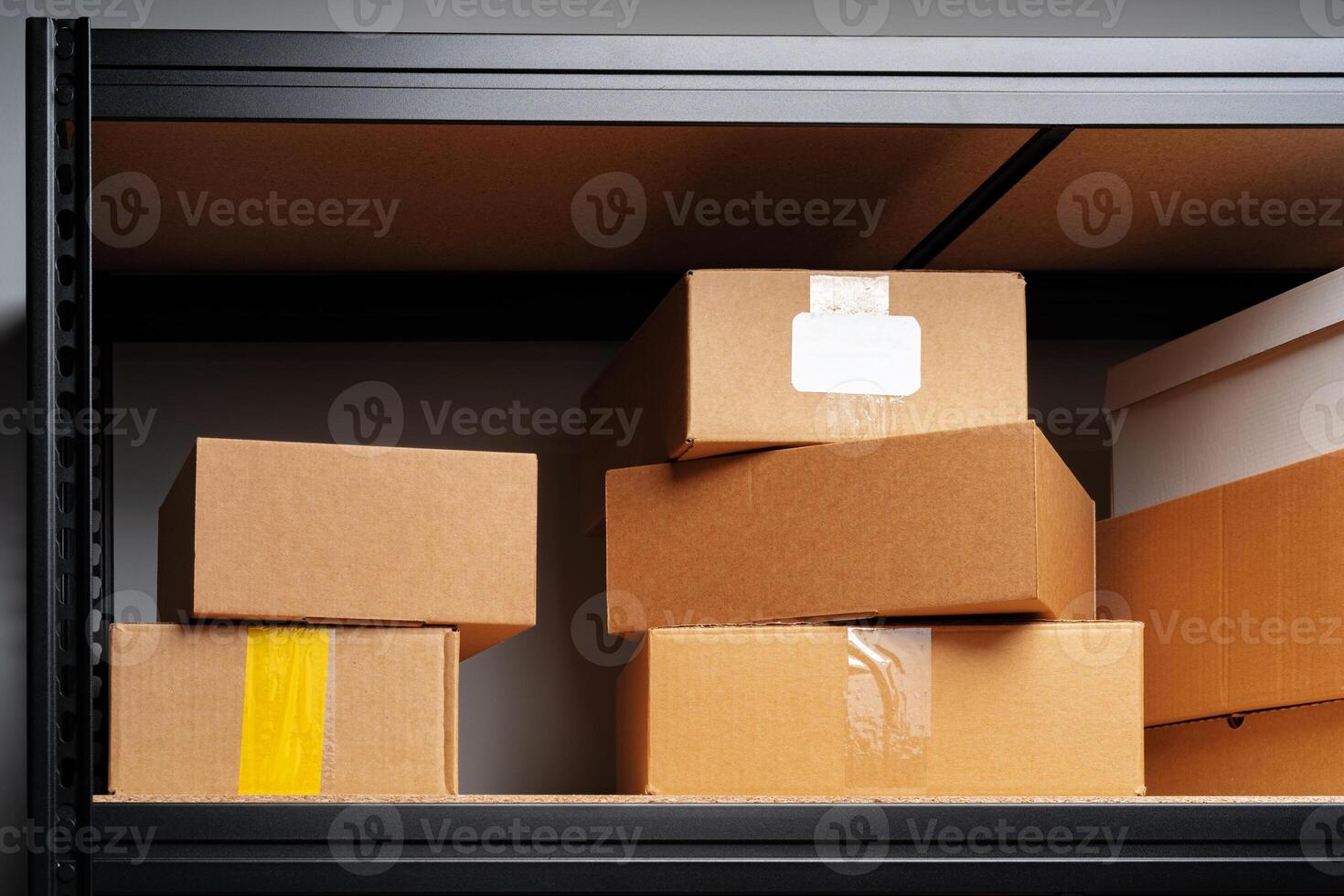 Rows of shelves with cardboard boxes in modern warehouse photo