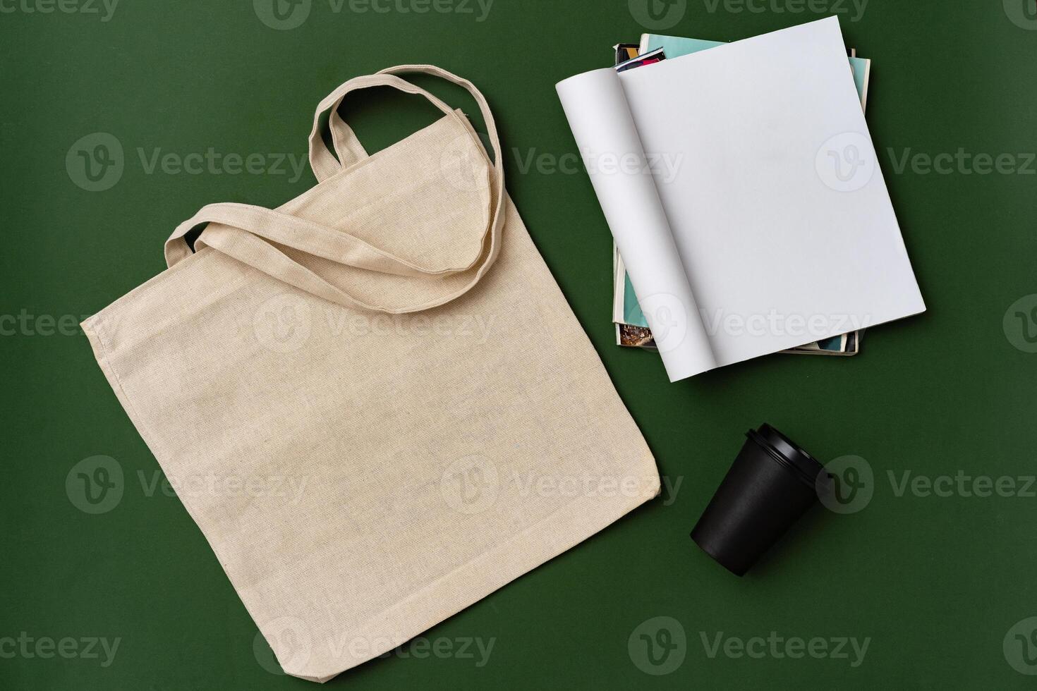 Textile shopping bag and coffee cup flat lay photo