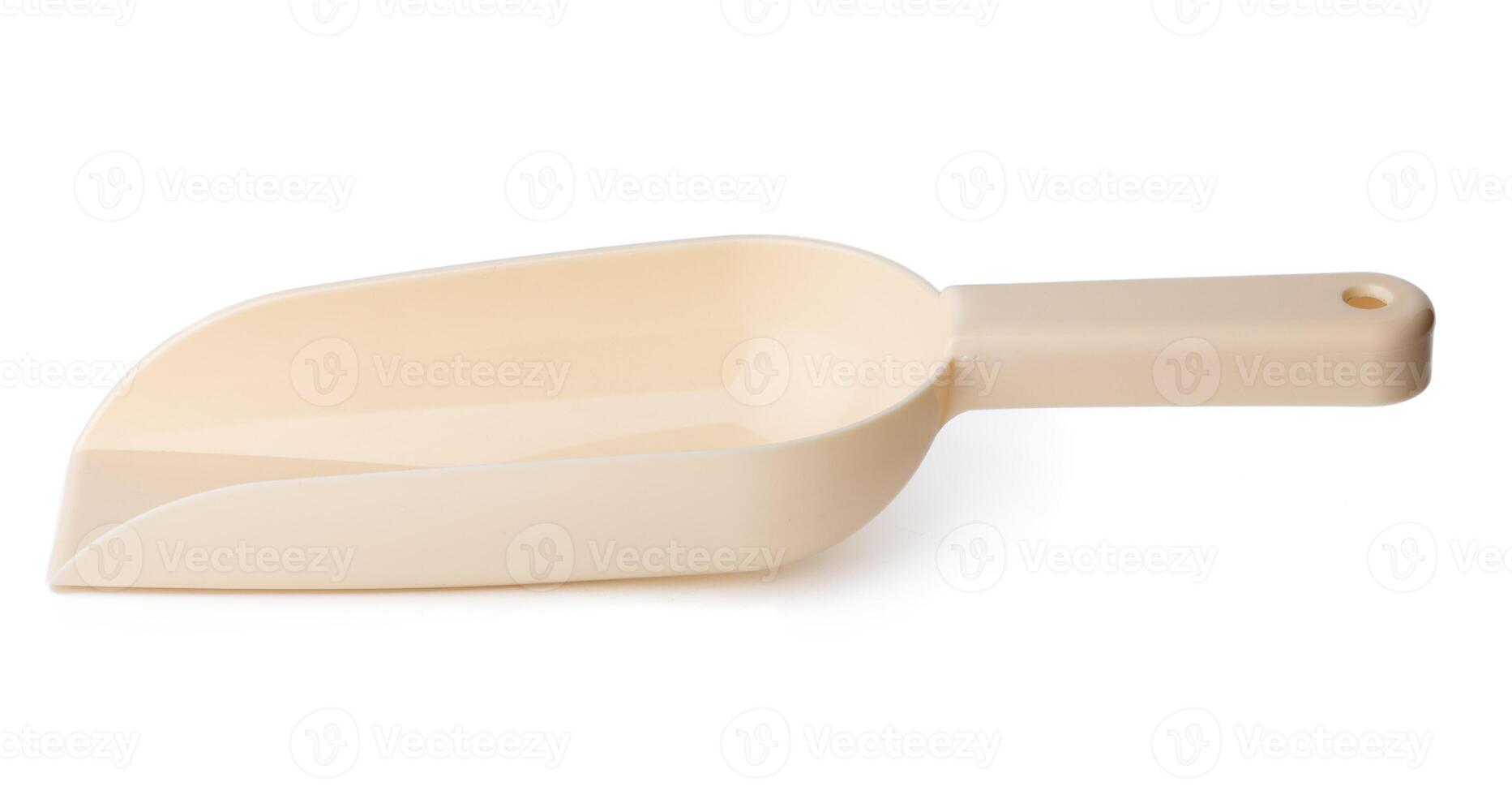 New plastic household scoop isolated on white photo
