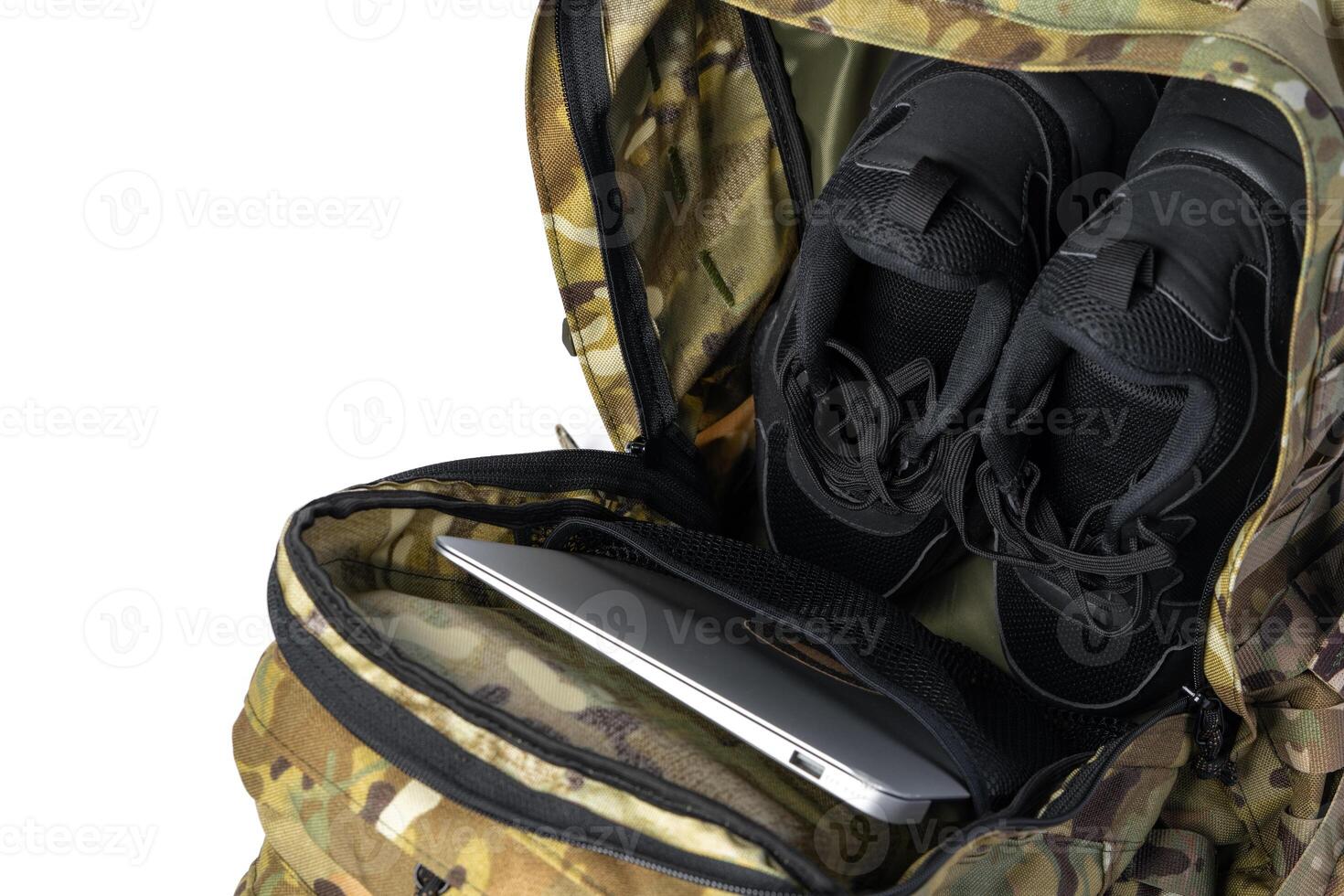Open military backpack of khaki color on a white background photo