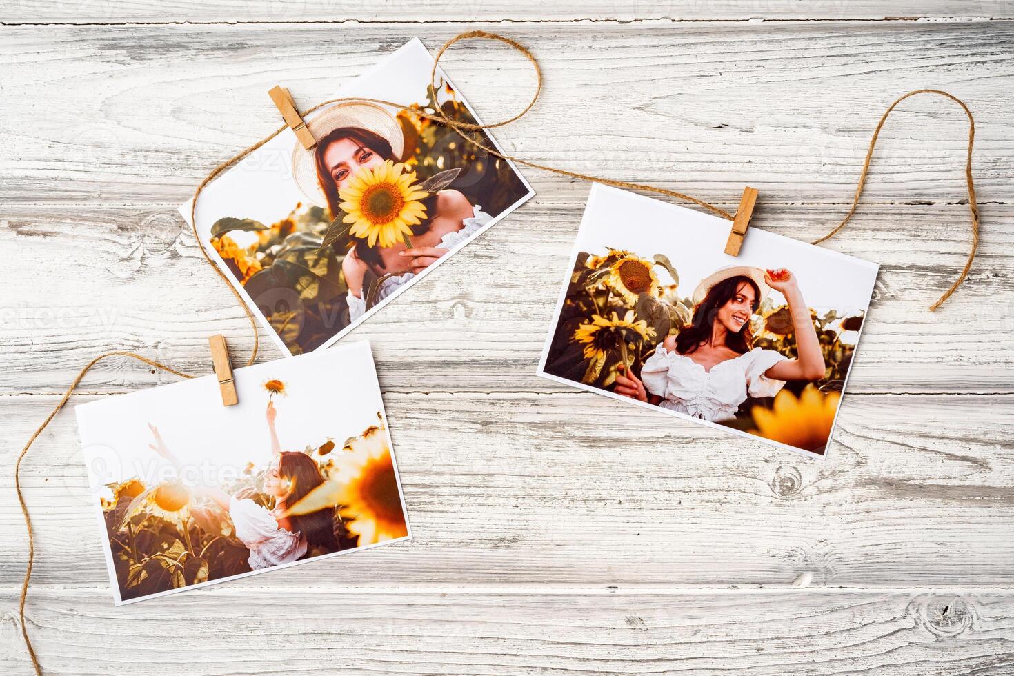 Printed colorful photos of women portraits against gray background