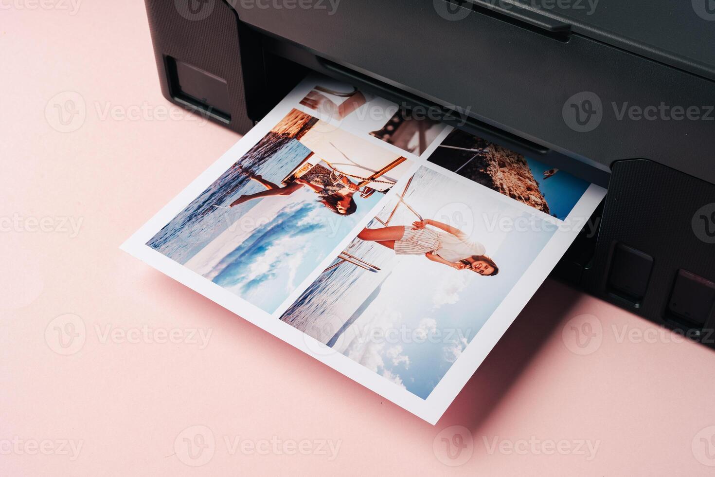Modern laser printer printing color photos of women close up