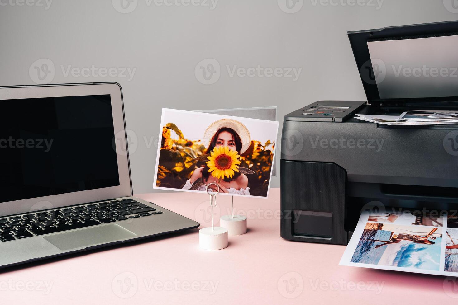 Computer laptop and printer on table. Printing photos