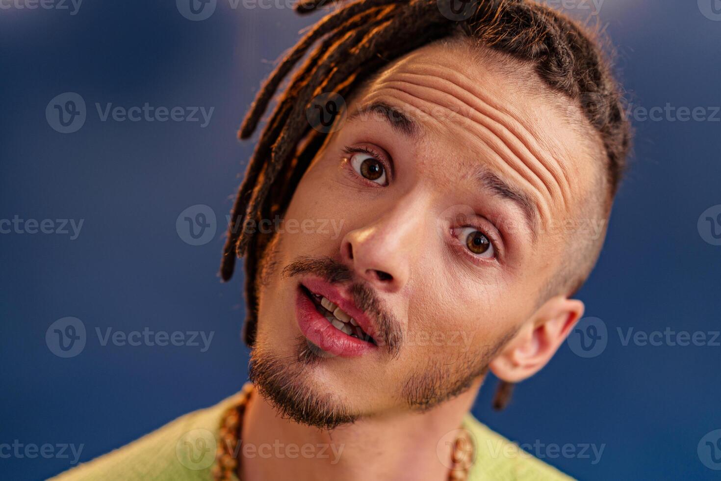 Portrait of a happy positive guy with dreadlocks photo