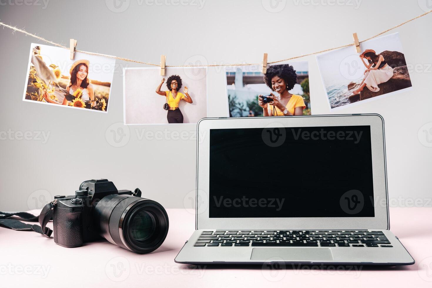 Laptop and camera on the table close up. Printing photos