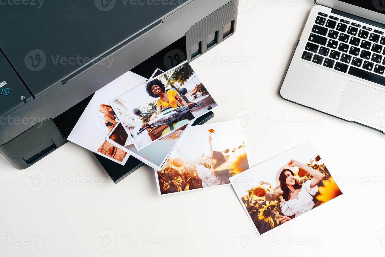 Computer laptop and printer on table. Printing photos