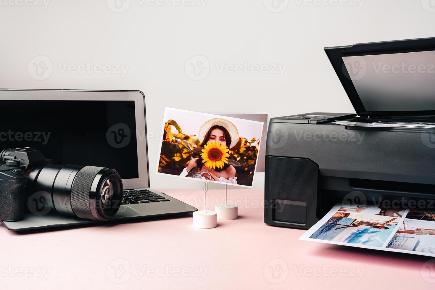 Printer, laptop and camera on table close up. Printing photos