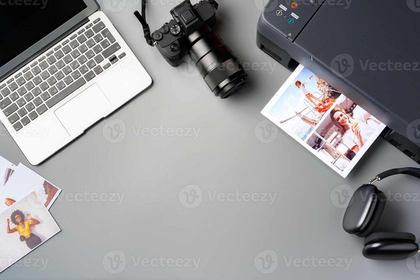 Printer, laptop and camera on table close up. Printing photos
