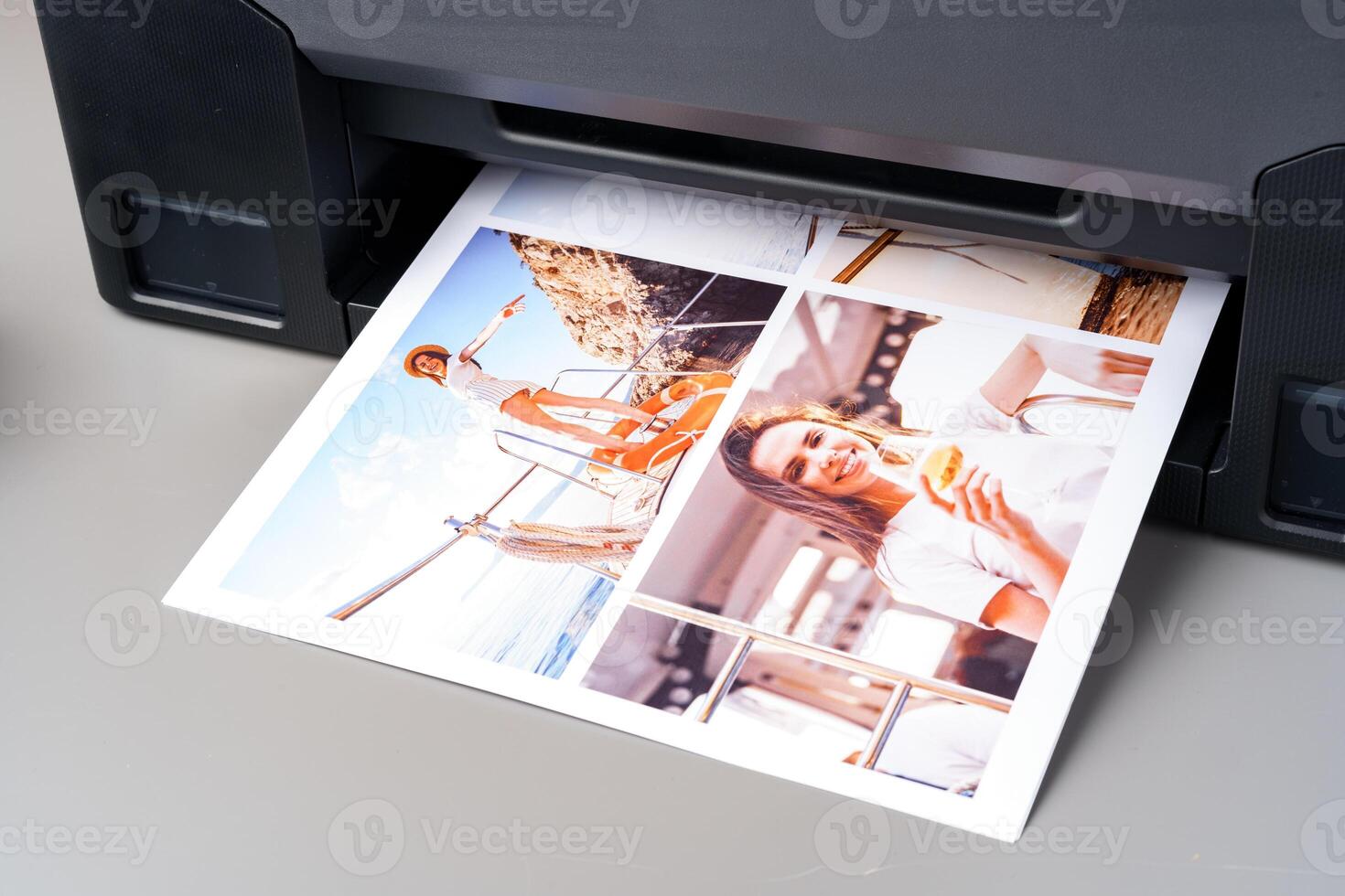 Modern laser printer printing color photos of women close up