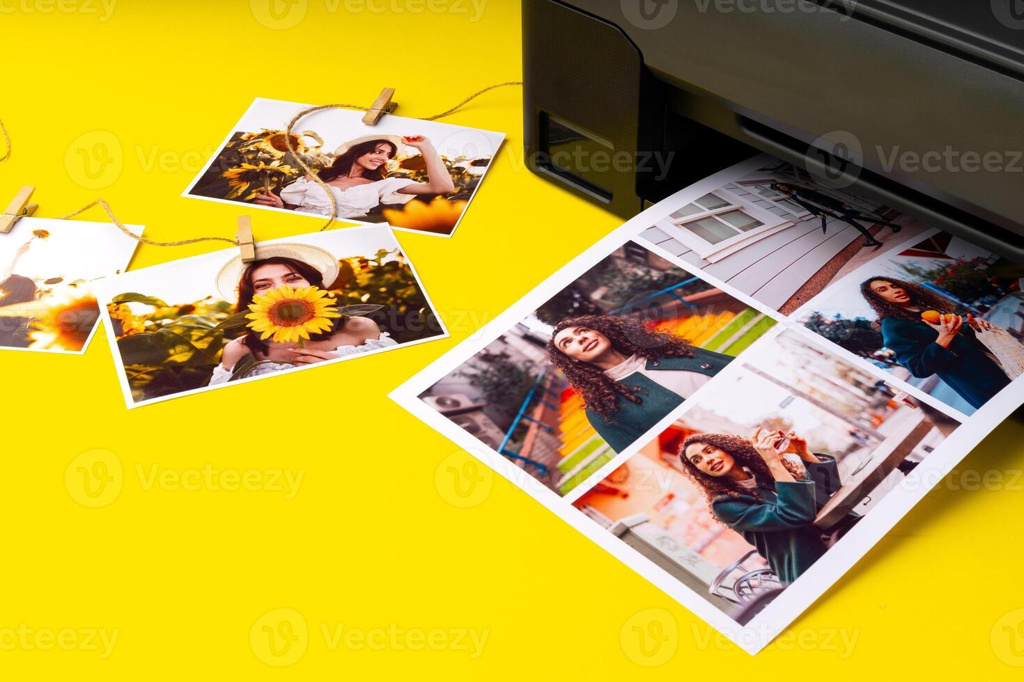 Printer printing colorful photos of people close up, yellow background