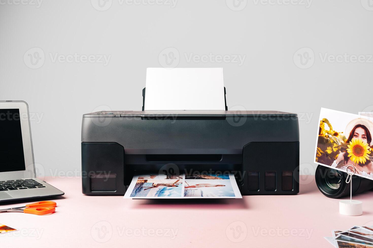 Printer, laptop and camera on table close up. Printing photos