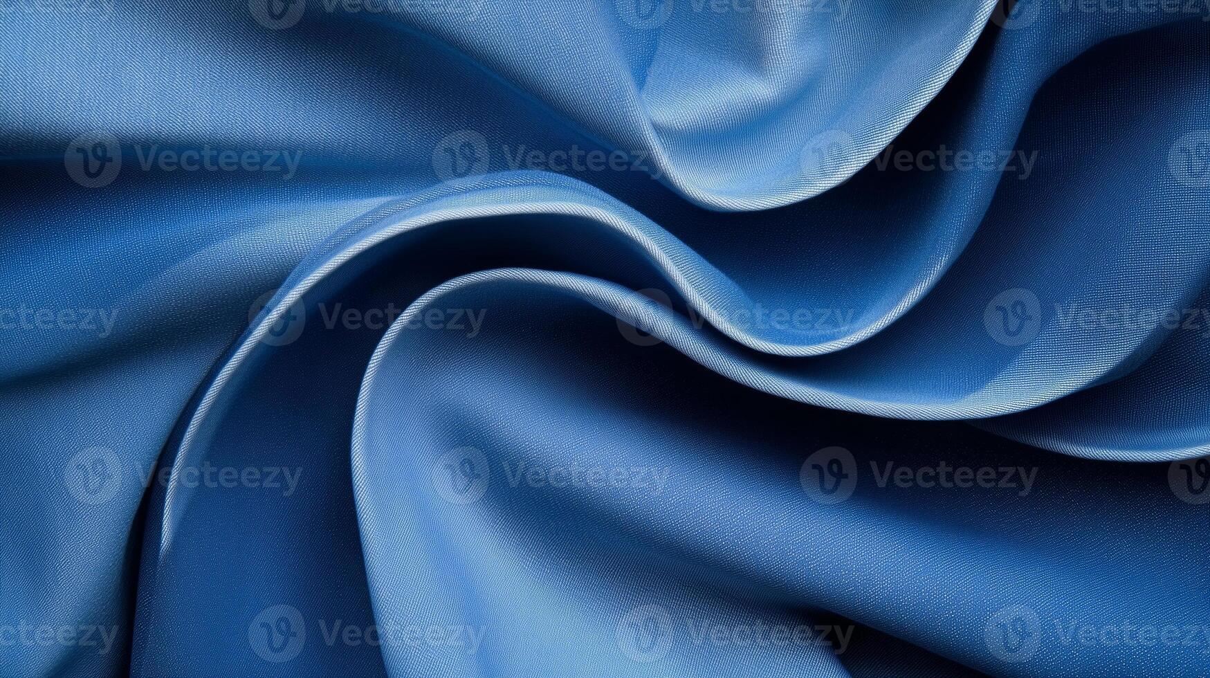 Silky blue fabric showcasing elegant draping and smooth texture in soft natural light photo