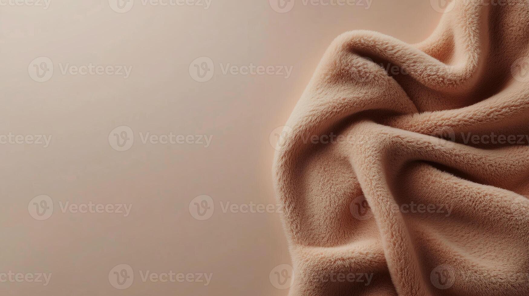 Soft, crumpled fabric in warm beige color on a neutral background showcasing texture and warmth in a cozy setting photo
