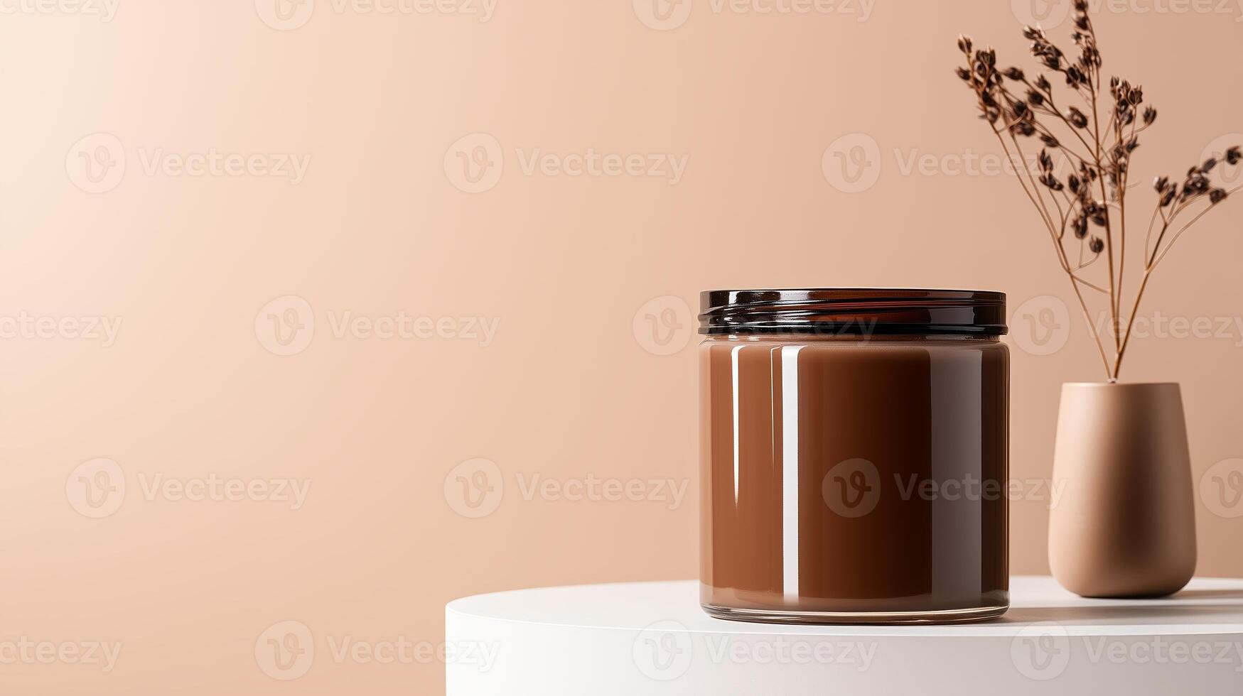 Stylish minimalist display featuring a jar of rich chocolate and a vase with dried flowers on a white pedestal photo