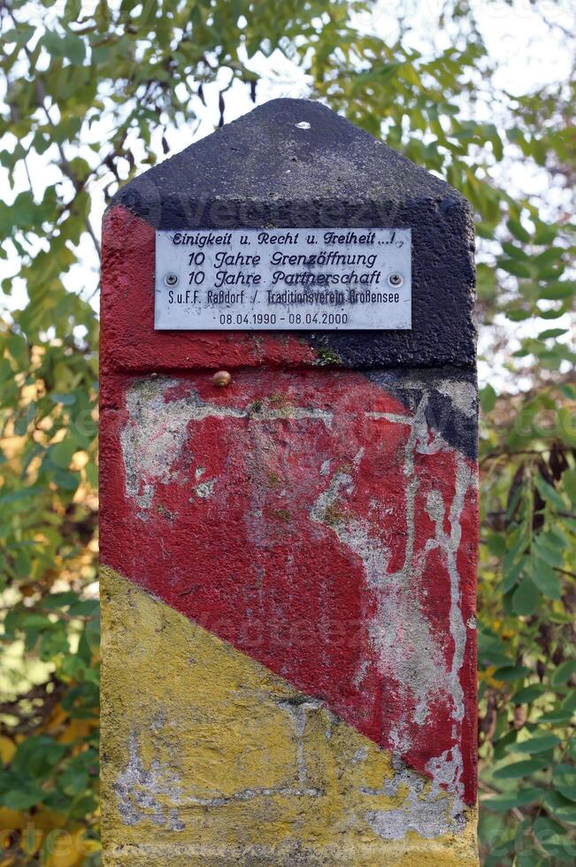 Boundary post at the former inner German border between Rassdorf, Hesse and Grossensee, Thuringia photo