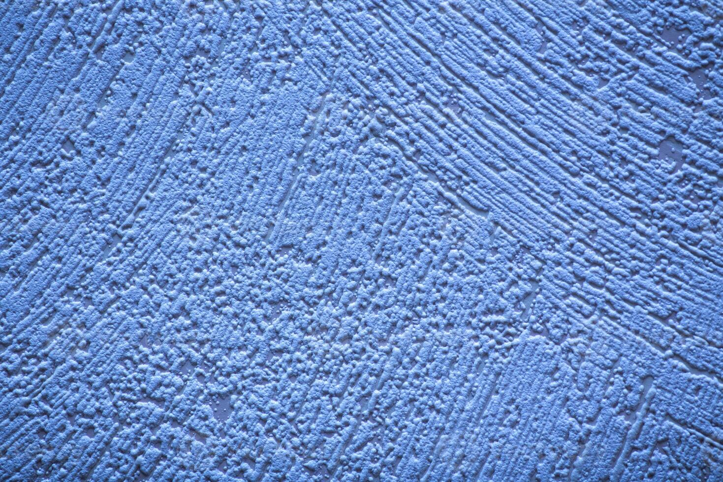 Conceptual shot of blue wallpaper with paint structure photo