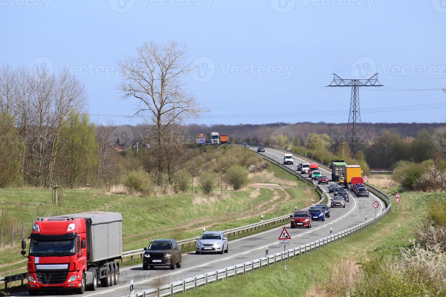 Traffic on a road with construction site in Mecklenburg-Vorpommern, Germany photo