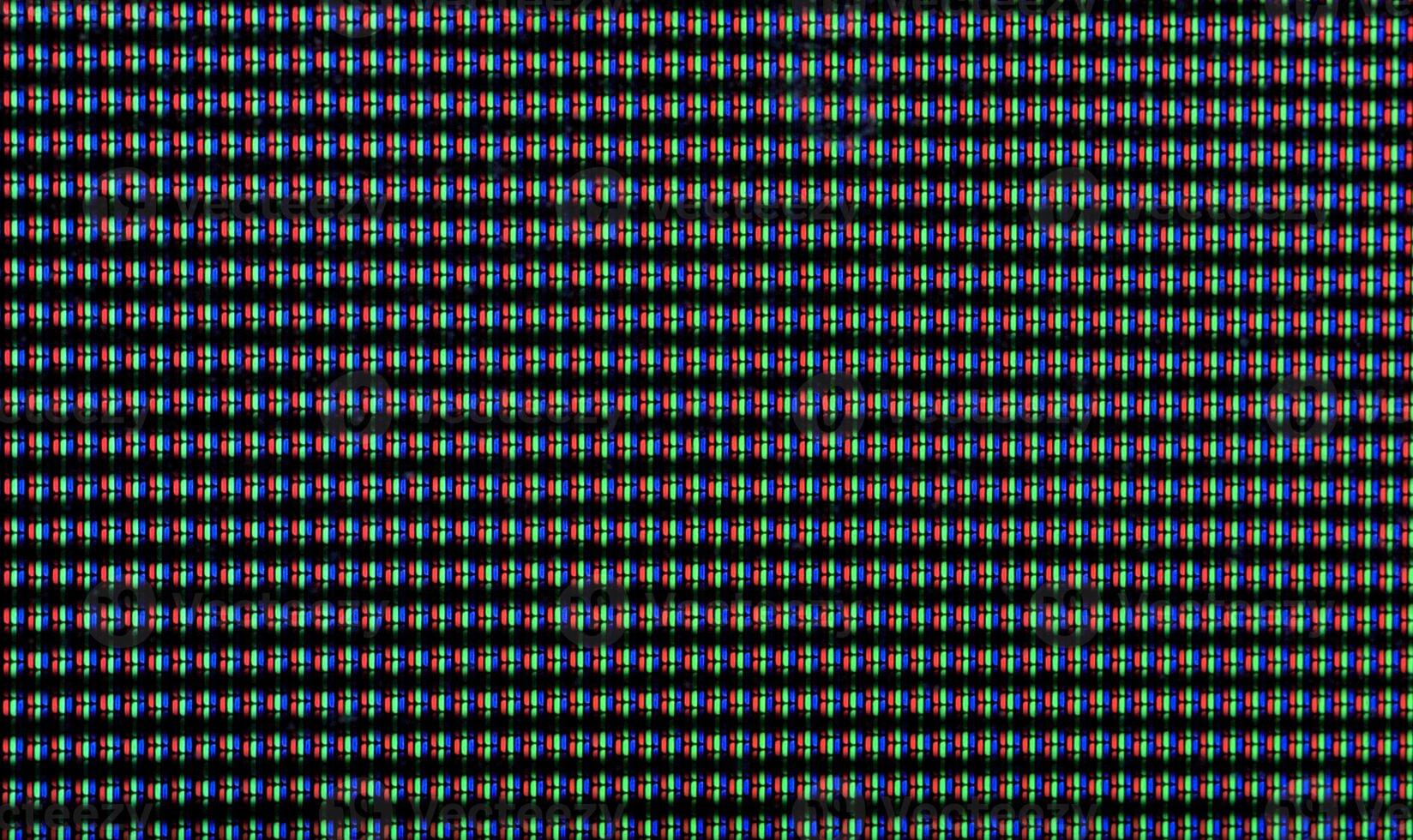 Macro shot of CRT screen with red, blue, and green dots photo