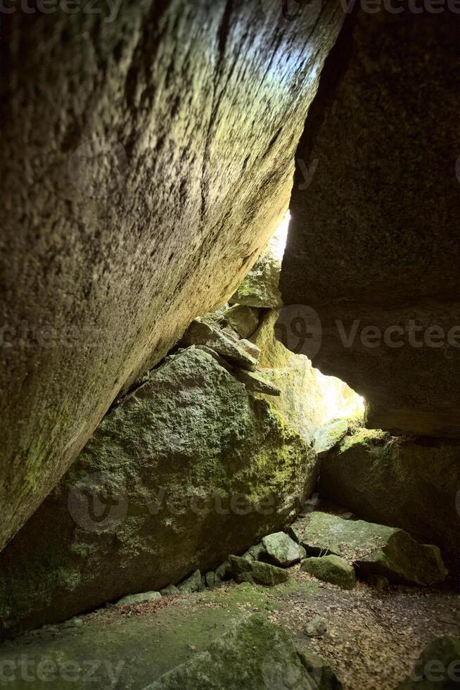 HDR image of cave under a big rock in Sweden photo